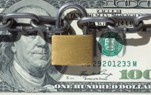 money locked with padlock