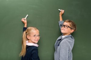 Kids at a chalkboard