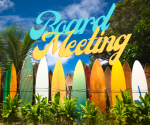A line of green, yellow, orange and white surfboards with the words "Board Meeting" in the sky above them